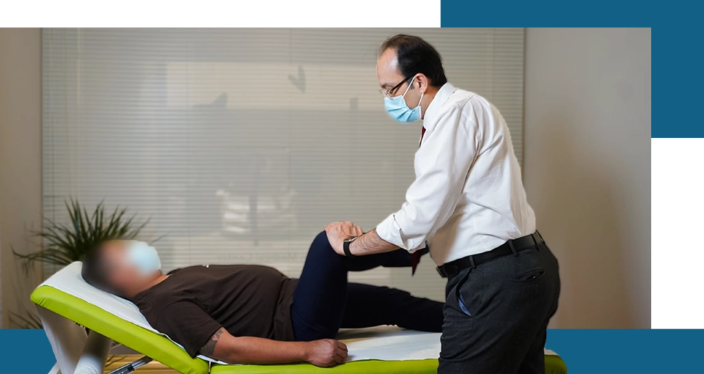 Dr. Mohamed Mashhour examining a man in a medical office